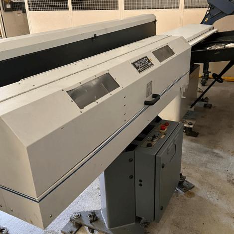 Hydrafeed MX-1B Multifeed bar feeder on workshop floor showing loading channel and rear assembly